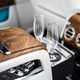Image for article titled BMW Patents Bottoms-Up Drink Filler So You Can Drink Even When the Chauffeur Picks Lousy Roads